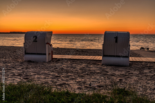 Fototapeta Naklejka Na Ścianę i Meble -  Evening at the Baltic Sea, with Beach chairs and the beach in Zierow, Mecklenburg-Western Pomerania, Germany