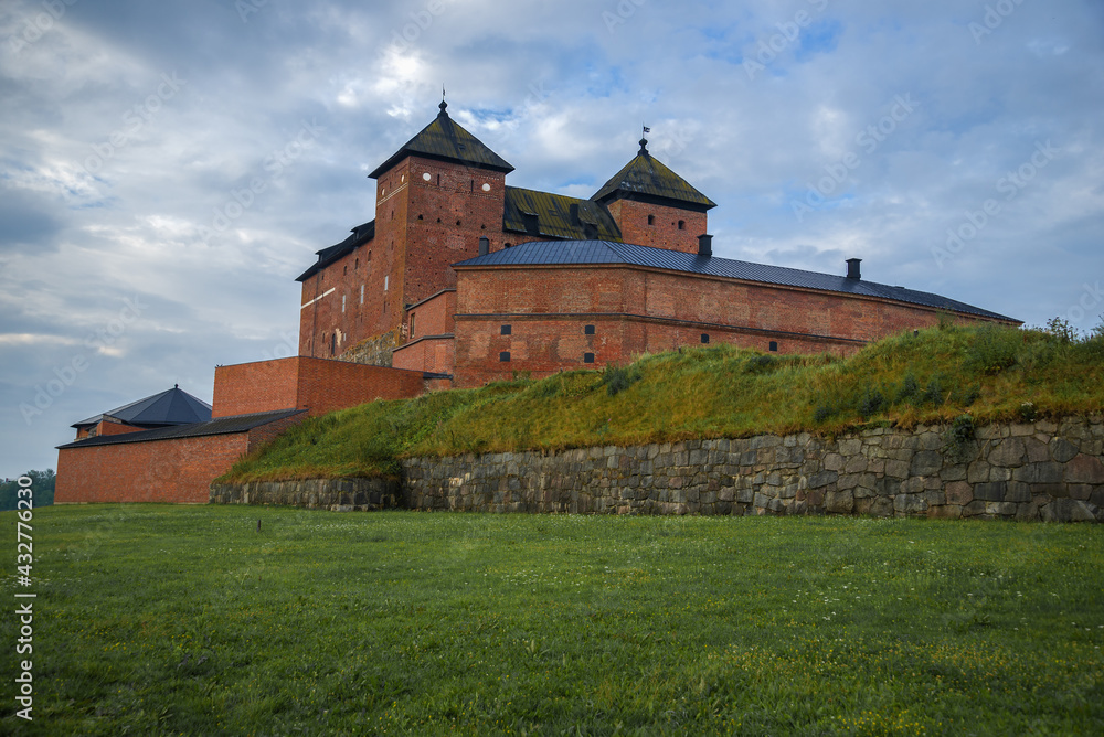 At the foot of the ancient fortress-prison on a cloudy July morning. Hameenlinna, Finland