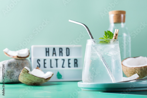 Tropical hard seltzer cocktail with coconut water and ice