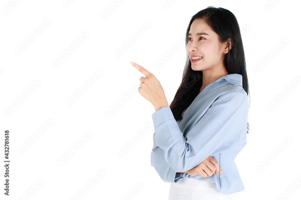 Close-up portrait of pretty woman wearing casual light grey clothes, pointing index finger up to copy space and happy expression by smiling wide opened mouth. Advertising concept. Close-up portrait of pretty woman wearing casual light grey clothes, pointing index finger up to copy space and happy expression by smiling wide opened mouth. Advertising concept.