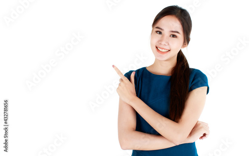 Close-up portrait of pretty woman wearing casual business dress, pointing index finger up to copy space and happy expression by smiling wide opened mouth. Advertising concept.