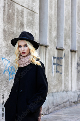 stylish beautiful woman in Hat walking in the city © photoagents