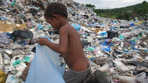 Poverty Boy Collecting Trash For Sell
 photo