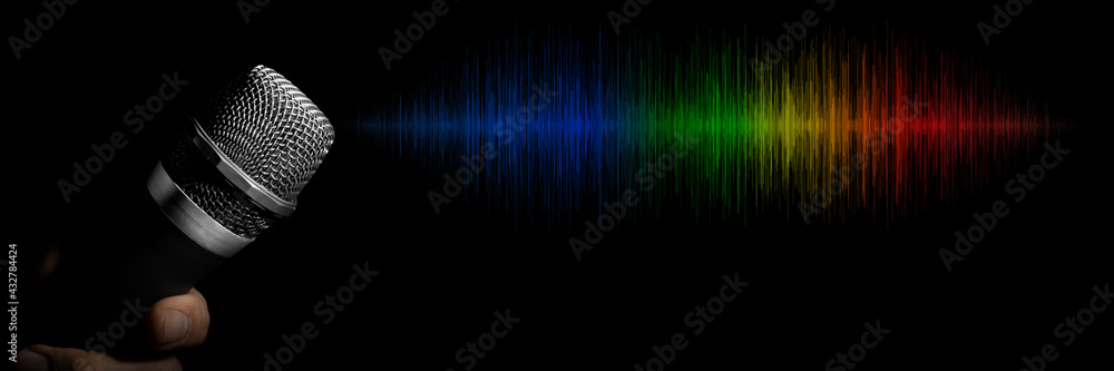 a man holding a microphone on a black background a man holding a microphone on a black background