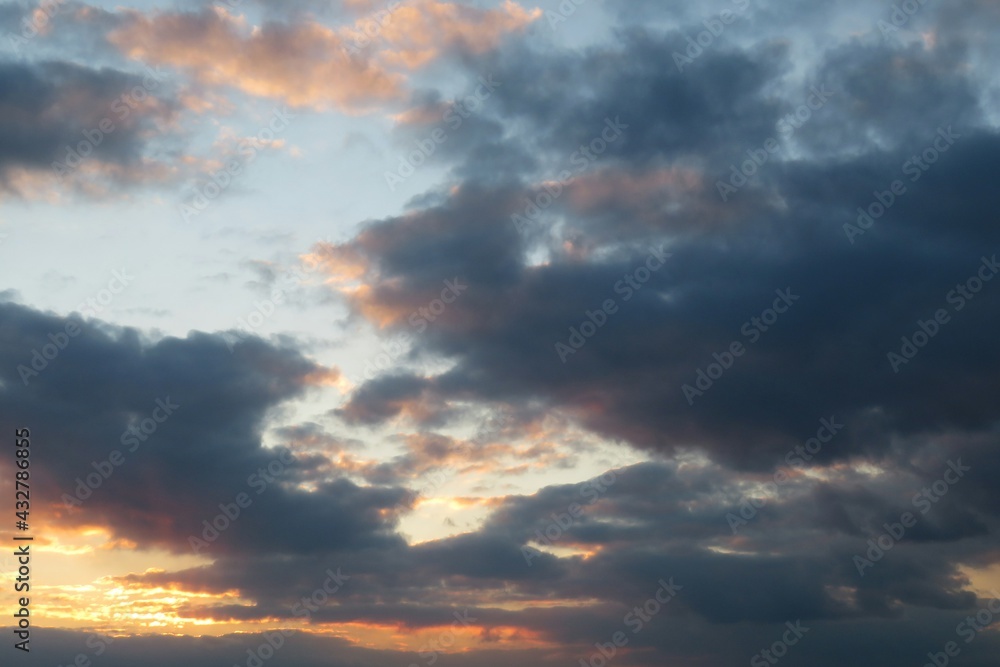 Beautiful dark sunset with black dramatic clouds, natural background