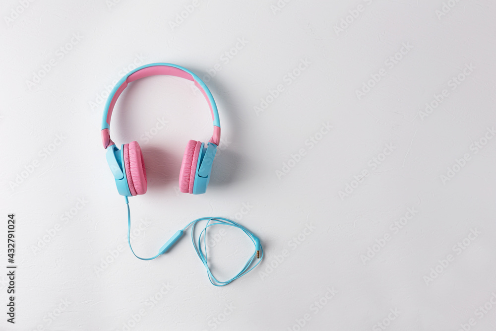 Pink and blue headphones on a white background Pink and blue headphones on a white background