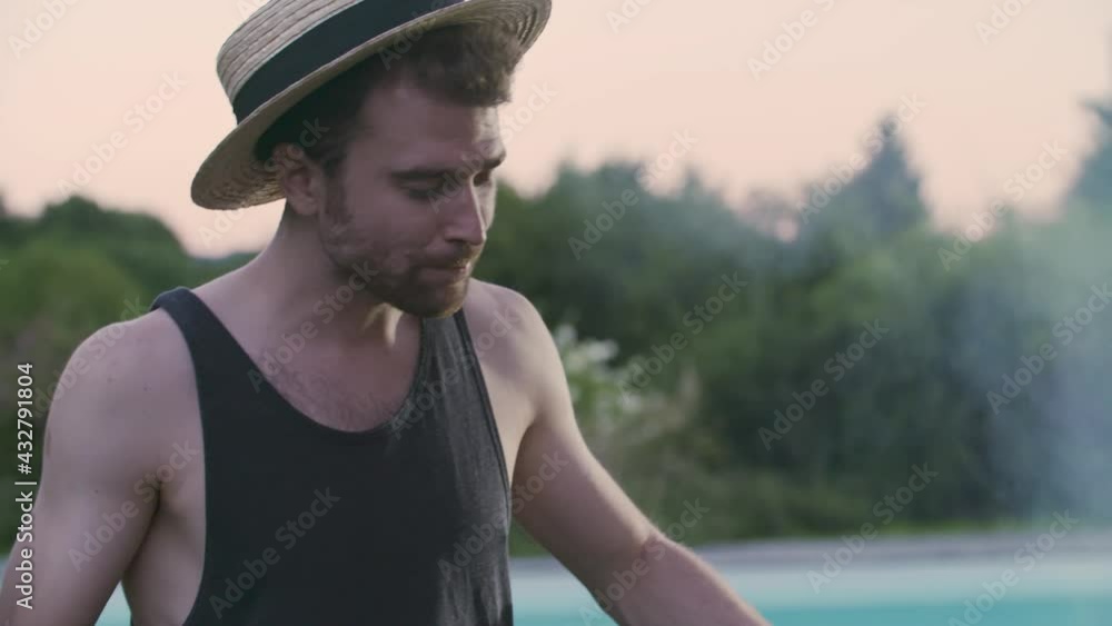 close up of smiling man with hat doing bbq. Summer, Spring break, friend, group, party, together, Man drinking fresh beee close up of smiling man with hat doing bbq. Summer, Spring break, friend, group, party, together, Man drinking fresh beee