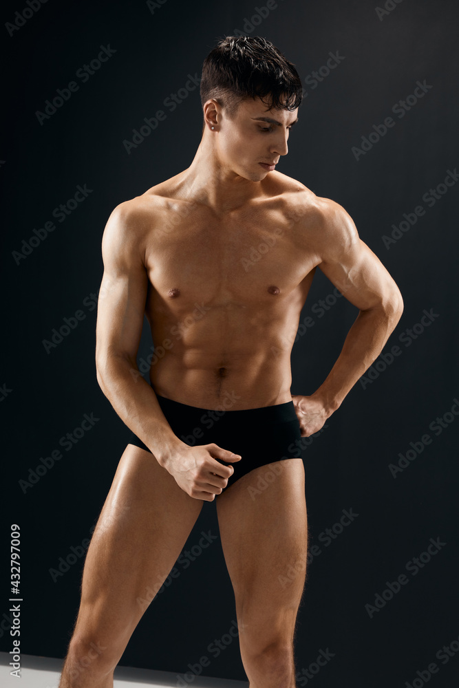 man with muscular body posing in dark panties man with muscular body posing in dark panties