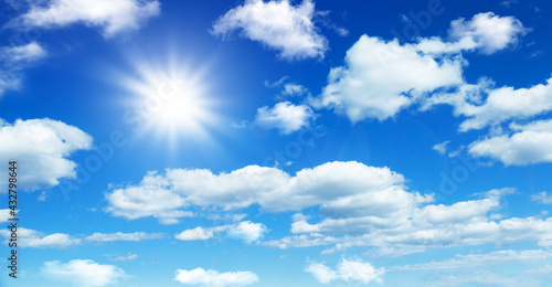 Sunny day background  blue sky with white cumulus clouds  natural summer or spring background with perfect hot day weather