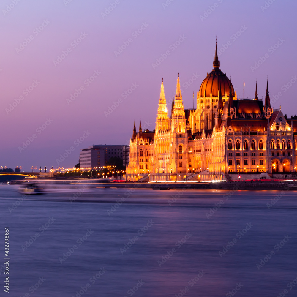 Fototapeta premium Beautiful building of Parliament in Budapest, Hungary, a popular travel destination at sunset