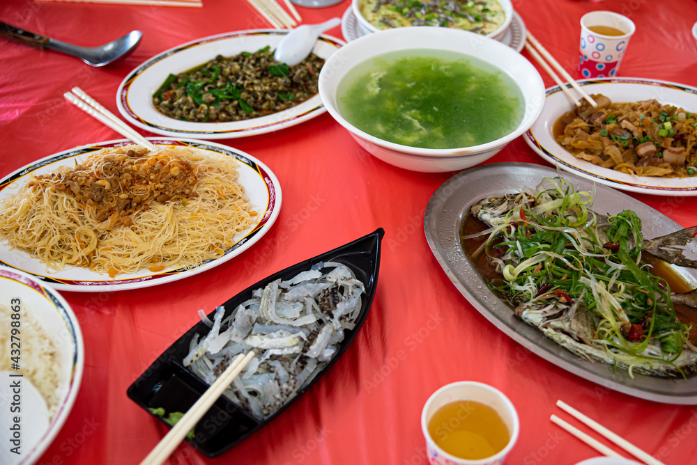 Table with different dishes of Chinese food