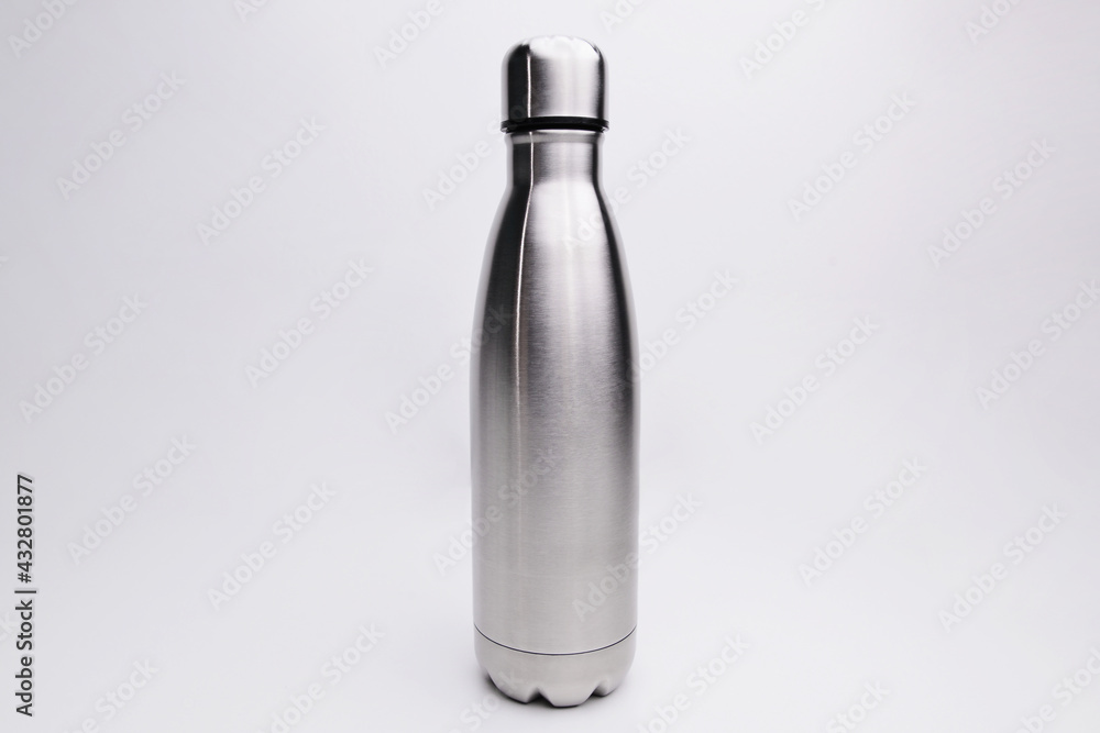 Stainless thermos water bottle, isolated on white background. Silver color. Blank stainless steel double wall workout bottle. empty stainless thermo water bottle close-up isolated on white background. Stainless thermos water bottle, isolated on white background. Silver color. Blank stainless steel double wall workout bottle. empty stainless thermo water bottle close-up isolated on white background.