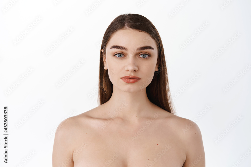 Skin care and beauty women. Close up portrait of woman face and shoulders, clean natural facial skin, hydrated and moisturized face, concept of skincare cosmetic, standing over white backround Skin care and beauty women. Close up portrait of woman face and shoulders, clean natural facial skin, hydrated and moisturized face, concept of skincare cosmetic, standing over white backround