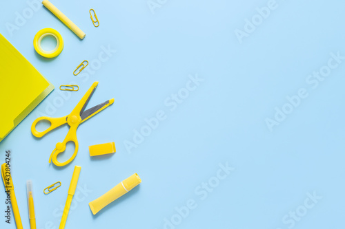 Yellow monochrome concept with stationery. Back to school background with copy space
