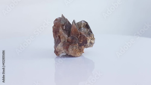 Axinite Crystals specimen on a rotating table photo