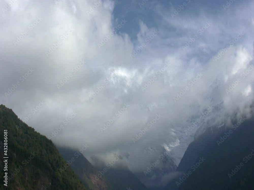 Time-lapse of clouds passing between the high peaks of the Himalayas (Annapurna Base Camp). Time-lapse of clouds passing between the high peaks of the Himalayas (Annapurna Base Camp).