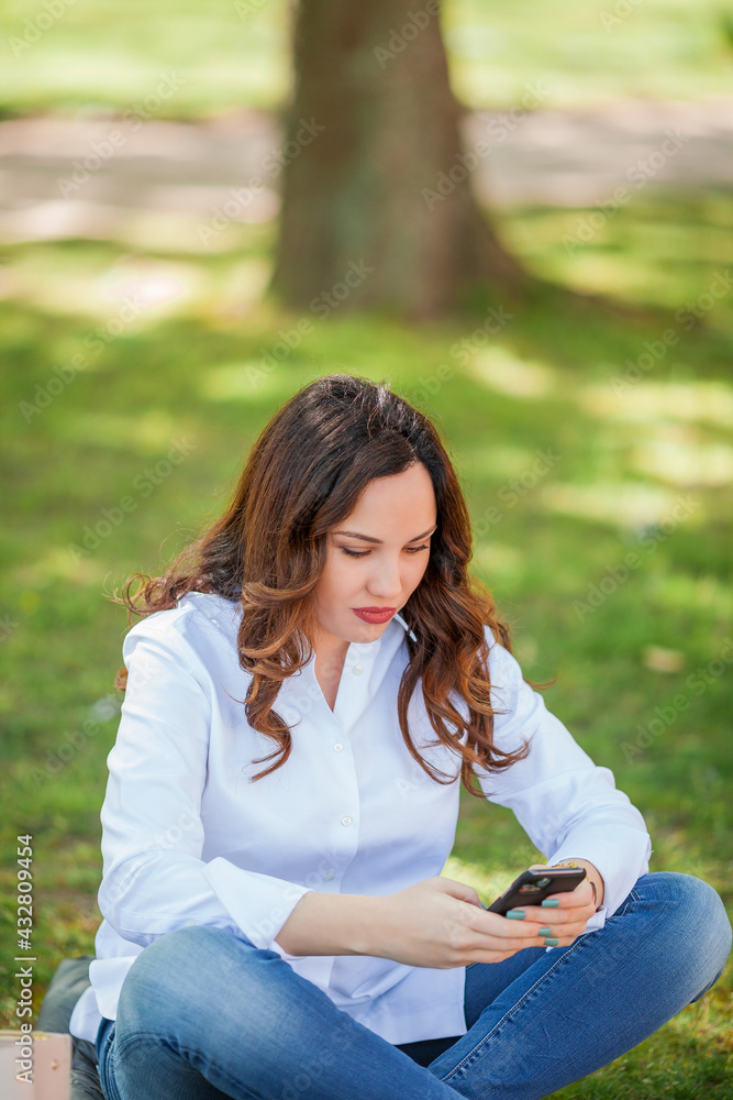 Young happy woman texting in the messenger. Quarantine. Young happy woman texting in the messenger. Quarantine.