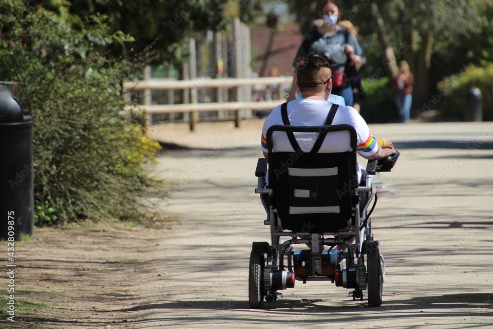 Obraz premium Man in an electric wheelchair