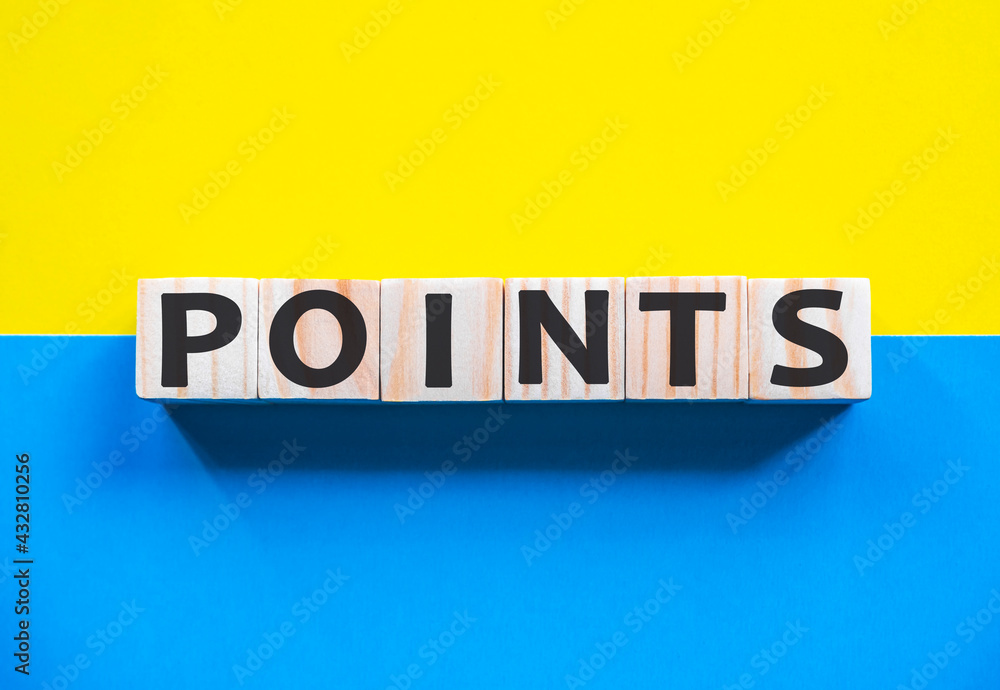 Word POINTS on wooden cubes with word on beautiful yellow and blue background. Business, media marketing concept.
