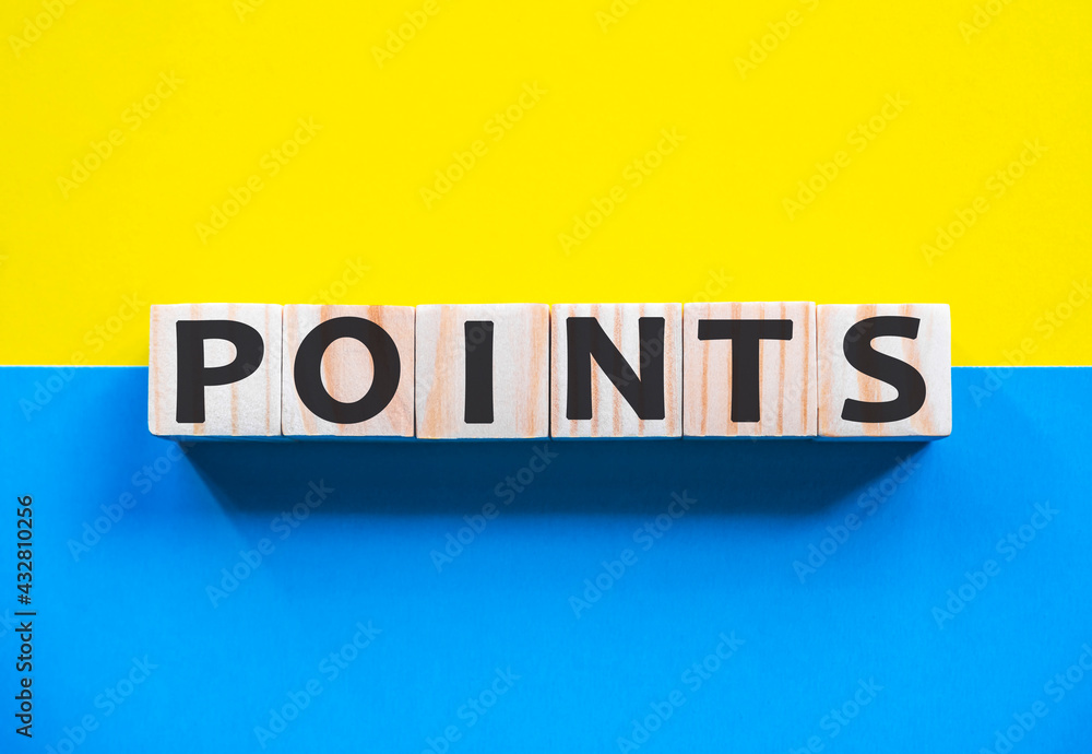 Word POINTS on wooden cubes with word on beautiful yellow and blue background. Business, media marketing concept. Word POINTS on wooden cubes with word on beautiful yellow and blue background. Business, media marketing concept.