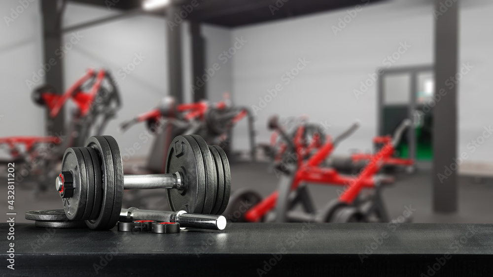 Fototapeta premium Dumbells on dark desk and free space for your decoration 