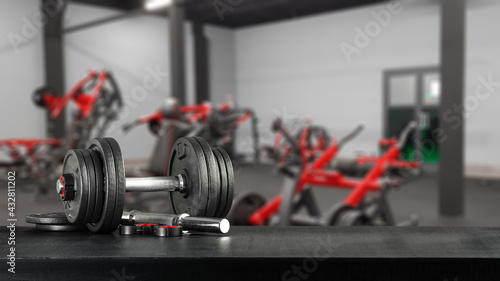 Dumbells on dark desk and free space for your decoration 