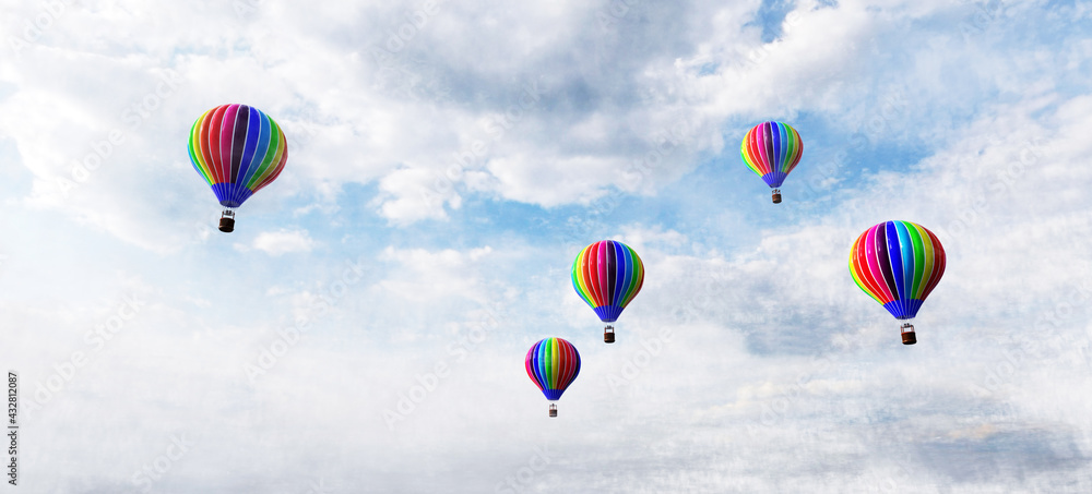 Obraz premium Hot air balloons flying above clouds