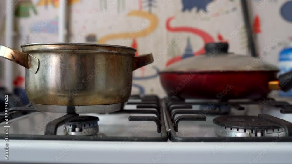 pot and frying pan on the kitchen, gas stove old russia pot and frying pan on the kitchen, gas stove old russia