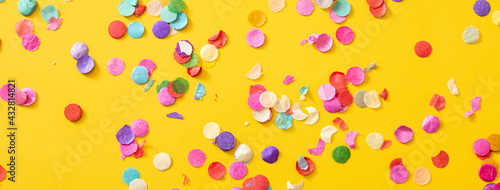 Fototapeta Naklejka Na Ścianę i Meble -  Colorful confetti on yellow background.Copy space