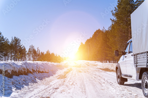 Adventure. car on winter snowy road in mountains in sunny day. Car on a winter road.