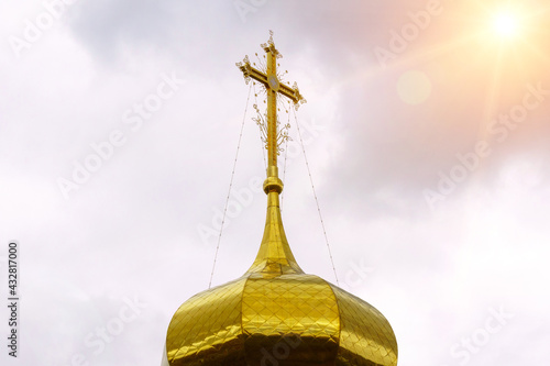 Domes of a religious building. Crosses on the domes of the church. Cathedral with gold domes.