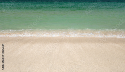 Sea sandy beach, sea rolling waves on the coast.