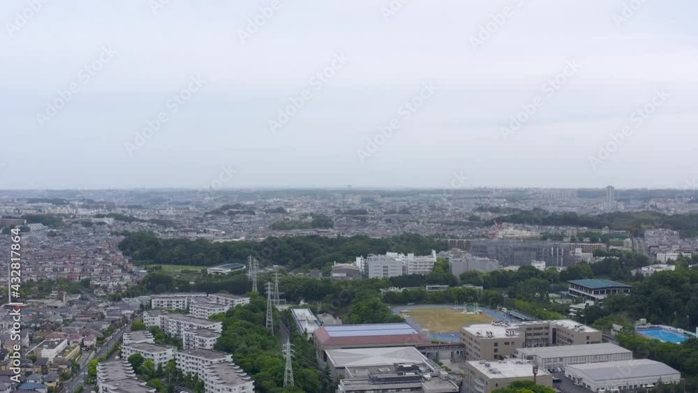 Drone shot of a residential area in yokohama japan. Houses, a school and the school ground can be seen from the sky in aoba district of yokohama. Drone shot of a residential area in yokohama japan. Houses, a school and the school ground can be seen from the sky in aoba district of yokohama.