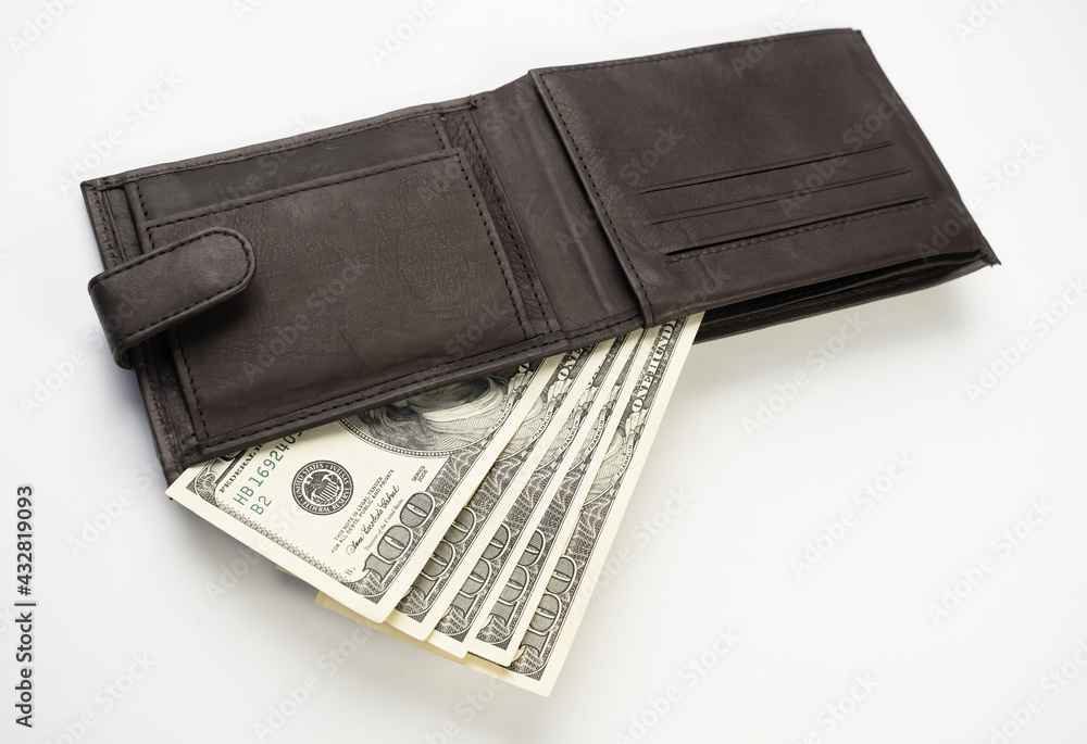 Leather wallet full of money on white background - fan of one hundred US banknotes with president Franklin portrait. Cash of hundred dollar bills, paper currency. Leather wallet full of money on white background - fan of one hundred US banknotes with president Franklin portrait. Cash of hundred dollar bills, paper currency.