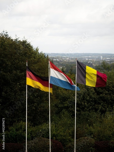 German dutch and belgian flags at triple border point Drielandenpunt Les Trois Bornes Dreilandereck, Vaalserberg Europe photo