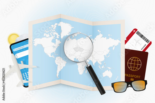 Travel destination Czech Republic, tourism mockup with travel equipment and world map with magnifying glass on a Czech Republic.