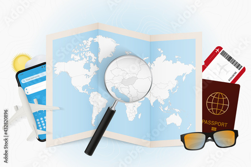 Travel destination Hungary, tourism mockup with travel equipment and world map with magnifying glass on a Hungary.