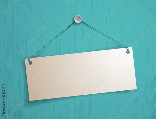 Blank paper piece hanging on a thread vector realistic illustration over wooden background, graphic design mockup for message.