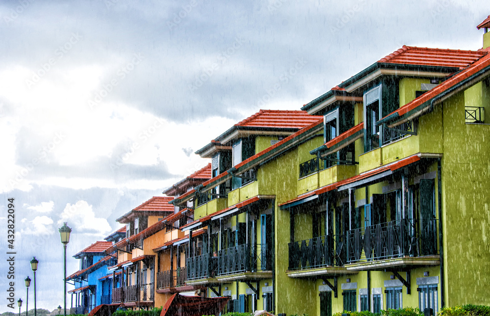 beautiful colorful buildings on the coast under rainy weather