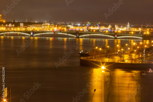 View of the embankment of the city of St. Petersburg at night with drawbridges