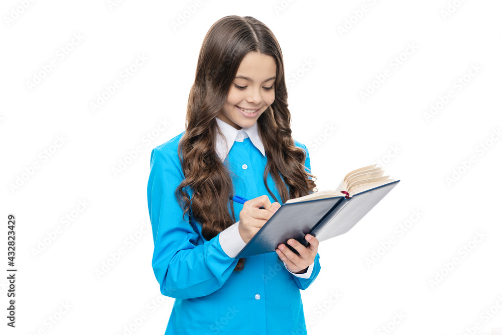 Happy kid write in school exercise book doing written homework assignment, studying Happy kid write in school exercise book doing written homework assignment, studying
