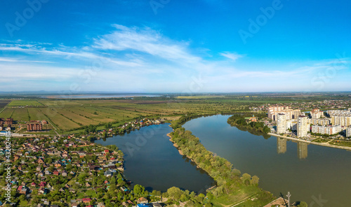 Lake Brzhegokai near the Kuban river not far from the city of Krasnodar in southern Russia with a sunny May morning - aerial view © Alexei Merinov