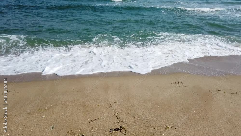 Beach, foamy ocean, sea waves washing sand. Waves hitting sand beach. Sound of the waves Beach, foamy ocean, sea waves washing sand. Waves hitting sand beach. Sound of the waves