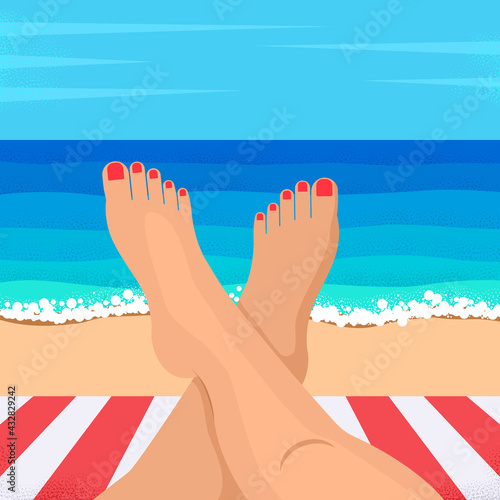 Legs of a young woman on the background of the ocean.