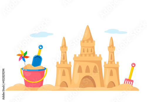 sand castle with baby bucket and shovel on the beach. the concept of vacation and travel with children.