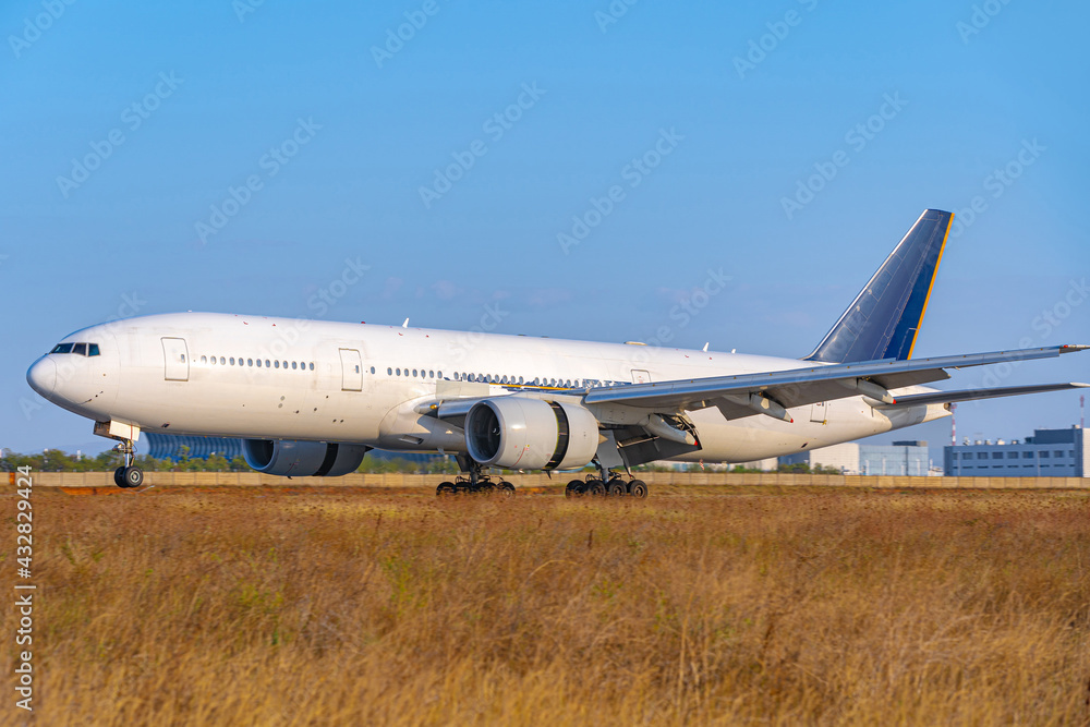 Big passenger airplane drives along the runway in airport Big passenger airplane drives along the runway in airport