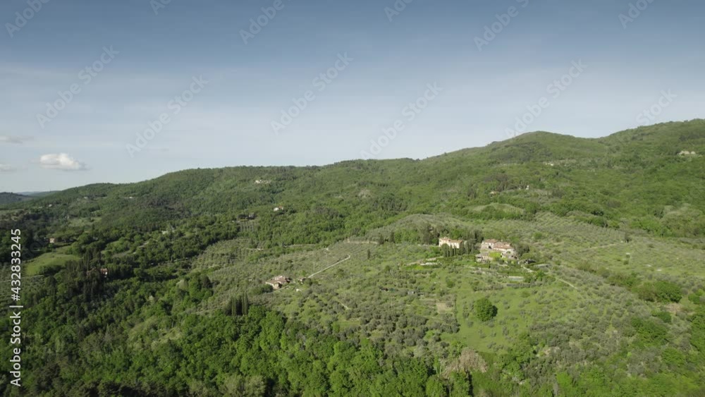 Aerial view above the tuscan countryside with forest and olive trees in Chianti region. Italy. Aerial view above the tuscan countryside with forest and olive trees in Chianti region. Italy.