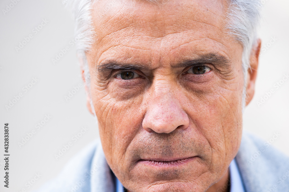 Close up older man head with eyes staring Close up older man head with eyes staring