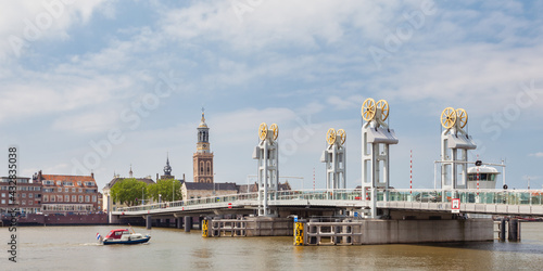Summer view of the river IJssel with entrance bridge of the Hanseatic historic city of Kampen, The Nertherlands