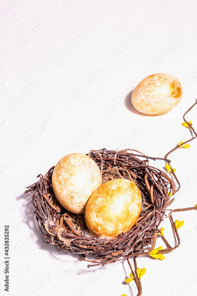 Golden Easter eggs in a wicker nest Golden Easter eggs in a wicker nest